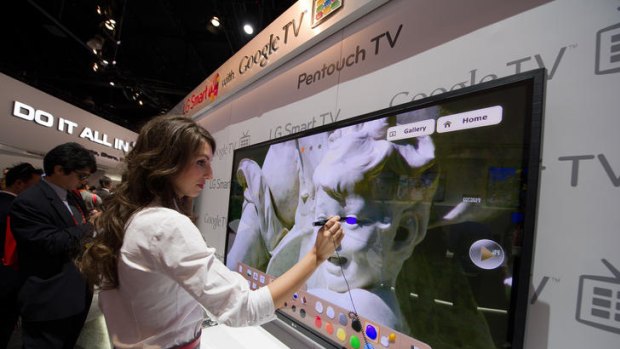 Amanda Musso, an actress, draws on the new LG Electronics PenTouch TV in a demonstration at CES.
