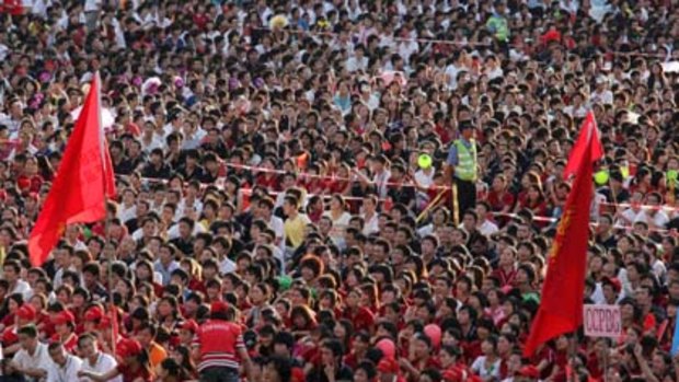 Foxconn employees gather to watch a rally at the Foxconn campus in the southern Chinese city of Shenzhen.