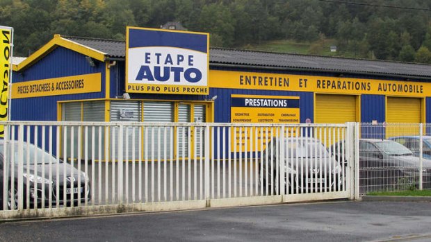 The garage in Terrasson, central France, where a child was found by mechanics in the truck of a car three days before.