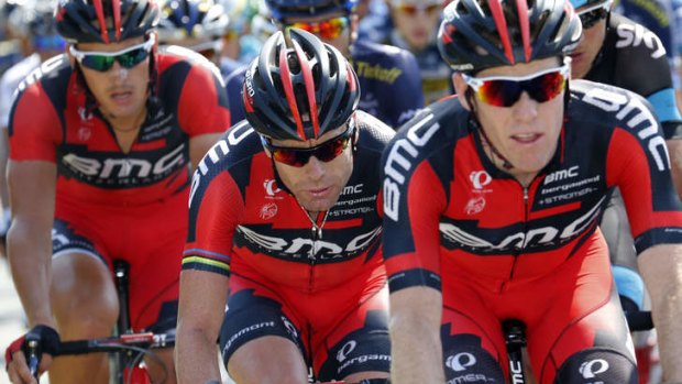 Cadel Evans toughs it out with teammates during the 197 km tenth stage of the Tour de France.