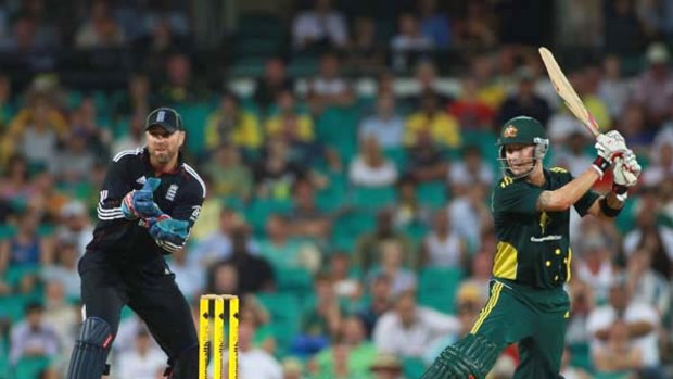 Michael Clarke lets fly during Australia's victorious run-chase.