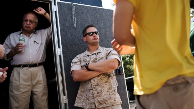 Captain Mike Malandra, centre, the ground branch head for the science and technology division at the Marine Corps Warfighting Laboratory.