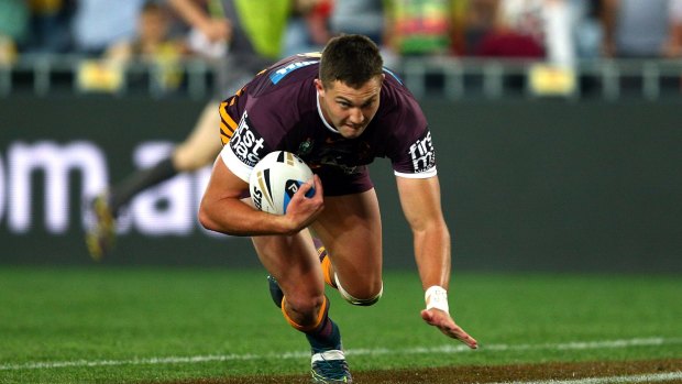 Corey Oates of the Broncos scores a try.