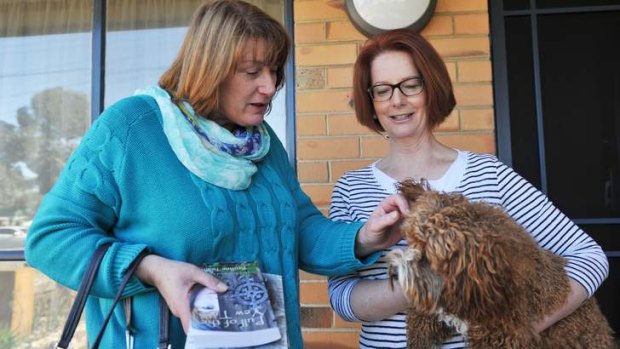 Former PM Julia Gillard with her dog Rueben at home, greets Joanne Ryan who has won a local ballot for Labor preselection for the seat of Lalor.