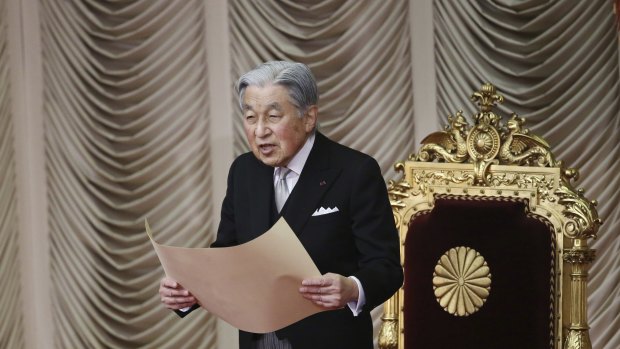 Japanese Emperor Akihito reads a statement to formally open a session in the upper house of Parliament in Tokyo last month.