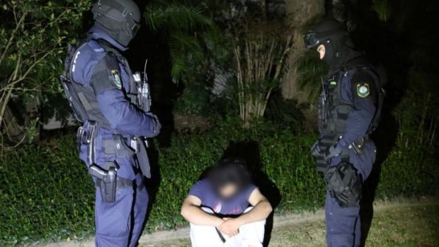Fifteen people have been arrested and one charged in counter-terrorism raids in Sydney and Brisbane.