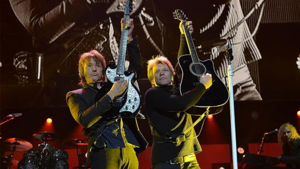 Richie Sambora and Jon Bon Jovi on stage together.