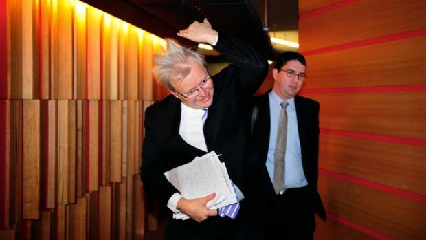 Kevin Rudd in Melbourne at Fairfax's Media House for a 3AW interview...flicking his hair.