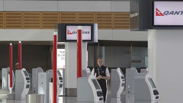 The Qantas check-in terminal at Sydney Airport was empty yesterday morning.