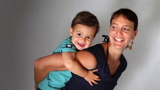 Timeo - pictured with his mother, Emilie Rouleau - has waited more than two years for full-time childcare.