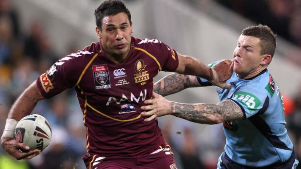 Bad memories: Justin Hodges of the Maroons gets past Carney during last year's series.