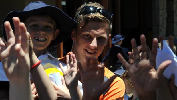GWS Giants No.1 draft pick Lachie Whitfield entertains kids from Burgmann College.