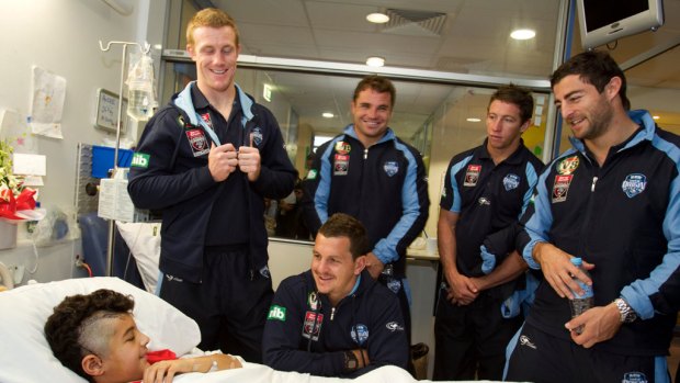 Scoring high for their bedside manners ... Blues players Ben Creagh, Greg Bird (sitting), Anthony Watmough, Kurt Gidley and Anthony Minichiello visit Andre Shehata at the Sydney Children's Hospital.