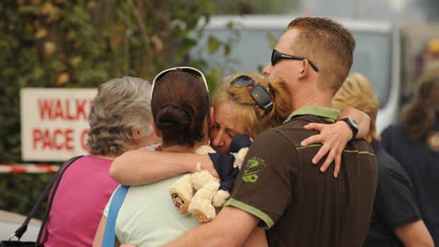 Marysville residents meet before being taken to their homes.