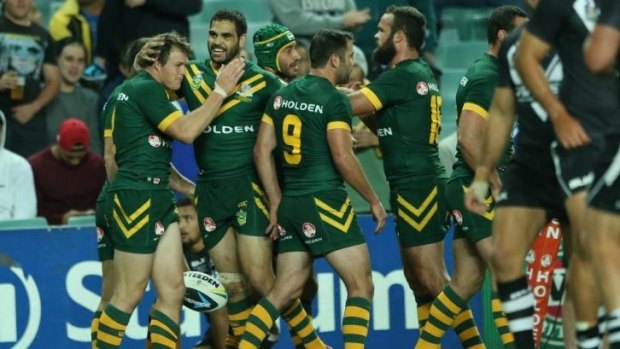 Bouncing back: the Kangaroos congratulate Brett Morris after the winger's 18th-minute try gave them the lead.