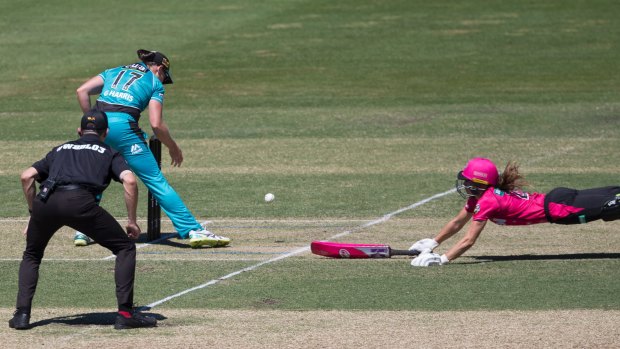 Erin Burns makes her ground for the Sixers against the Brisbane Heat at Hurstville Oval.