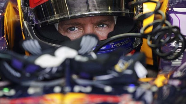 Sebastian Vettel sits in his car during the second practice session of the Italian F1 Grand Prix at the Monza circuit on Friday.