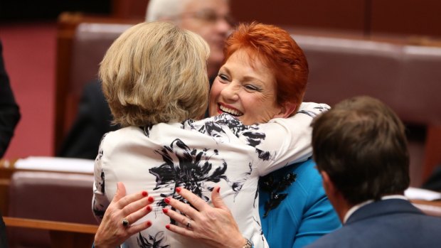 Senator Michaelia Cash hugs Senator Pauline Hanson after her first speech to the Senate in September.