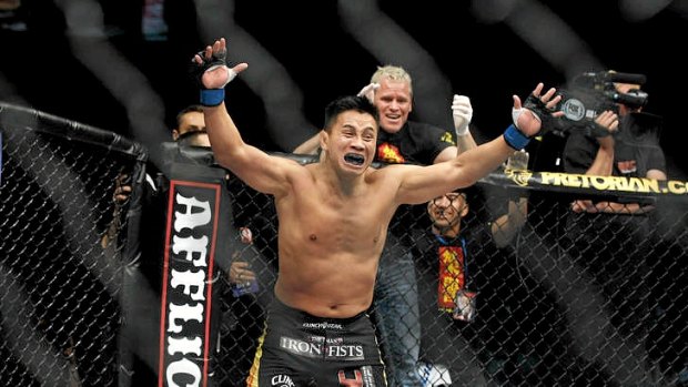 Cung Le celebrates after knocking out Rich Franklin in their UFC middleweight bout in Macau.