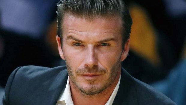 British soccer star David Beckham won't be getting hand cramp when signing his new photo books.