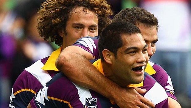 Easy winners ... Adam Blair is congratulated by Cameron Smith after scoring a try.