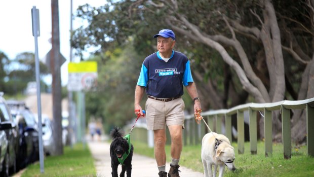 Brian Parcell, of Maroubra, takes his dogs Ollie and Tessa for a walk.