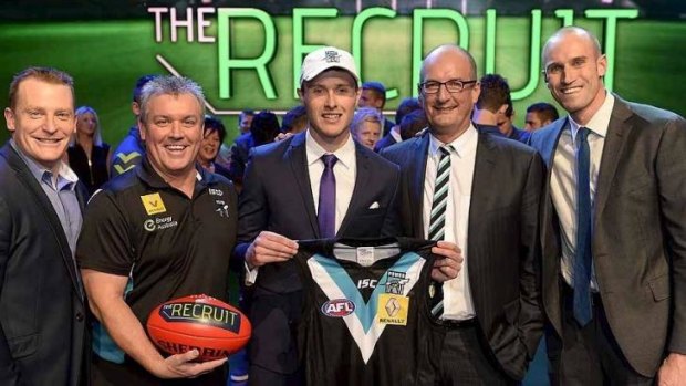 Top recruit: Johann Wagner (centre) has signed with the Port Adelaide Football Club.