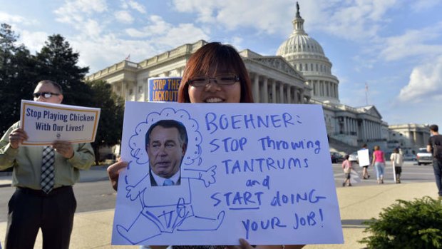 Protest: A demonstration in front of the US Capitol in Washington on Tuesday urging Congress to pass the budget bill.