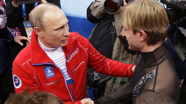 Golden moment: Vladimir Putin congratulates Evgeni Plushenko.