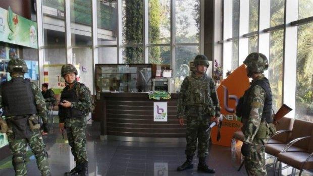 Thai soldiers occupy the foyer of the National Broadcasting Services of Thailand television station in Bangkok.