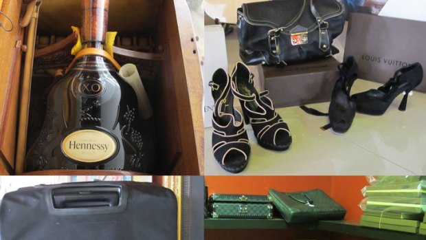 Clockwise from top left: A six-litre bottle of Hennessy valued at $25,000; Yves Saint-Laurent Shoes, value unknown; a range of Louis Vuitton bags, value unknown; a Louis Vuitton suitcase valued at $10,000.