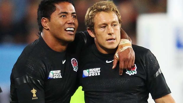 Jonny Wilkinson and Manu Tuilagi of England celebrate victory after their match against Argentina. Tuilagi's mouthguard breached tournament guidelines.