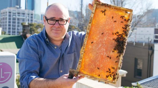 Doug Purdie with  bees at his home