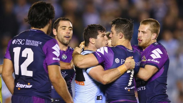 Getting under the opposition's skin: Michael Ennis and Cooper Cronk scuffle.
