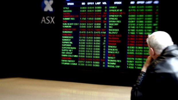 Investors view the ASX stock board on Bridge Street in Sydney.