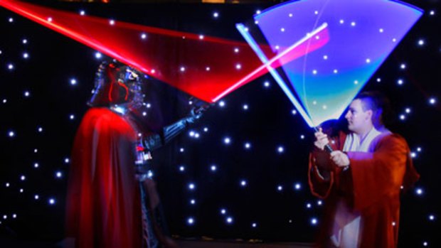 Darth Vader takes on a Jedi warrior in a light-sabre duel, one of the interactive displays at the exhibition.