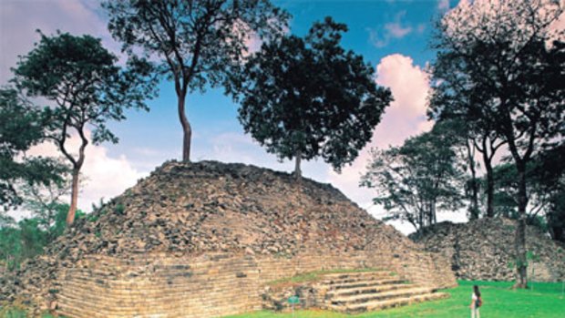 Lone tourist ... the temple ruins in the remote south of Belize attract few sightseers and even fewer tourism dollars.