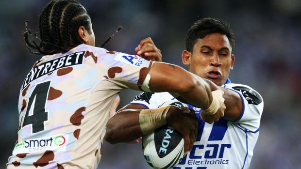 Getting tough ... Steve Matai of the Eagles attempts to tackle Ben Barba.