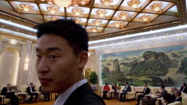 A bodyguard stands watch as US national security adviser Susan Rice meets Chinese President Xi Jinping in the Great Hall of the People in Beijing. 