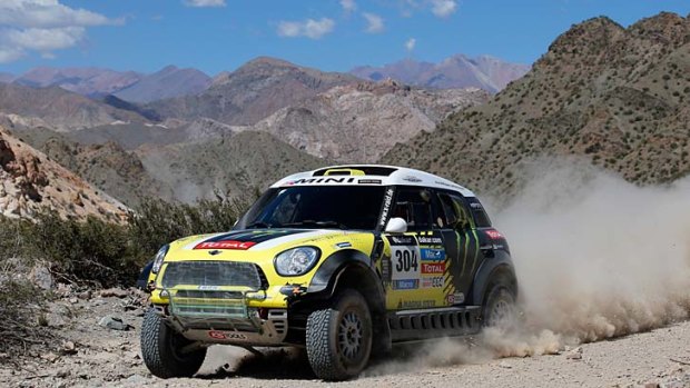 Spaniard Nani Roma and Frenchman Michel Perin compete in the Dakar Rally.