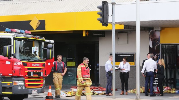 Emergency services outside the Springvale bank after the attack.