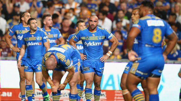 Tim Mannah and his Eels teammates contemplate defeat.