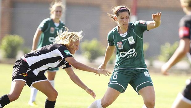 Caitlin Munoz of Canberra United and Gema Simon of Newcastle Jets contest possession during the round eight W-League match on Saturday.
