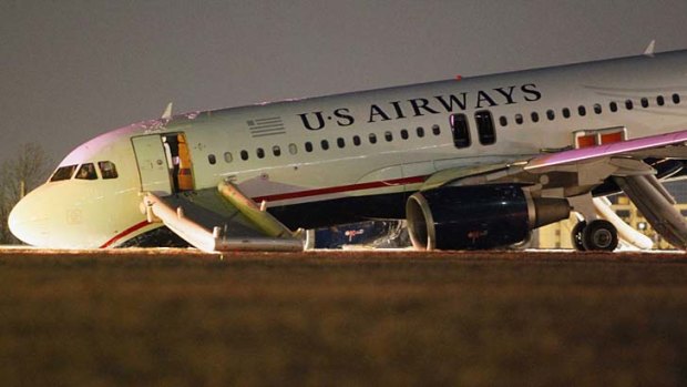 Collapsed: The US Airways plane on the runway   at Philadelphia International Airport.