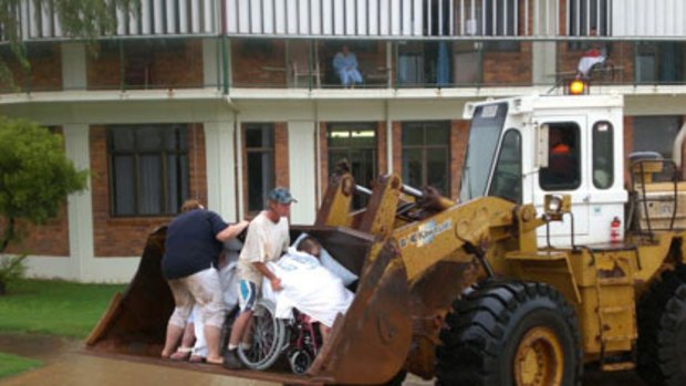 An unorthodox method is used to evacuate elderly residents from a Charleville hostel.