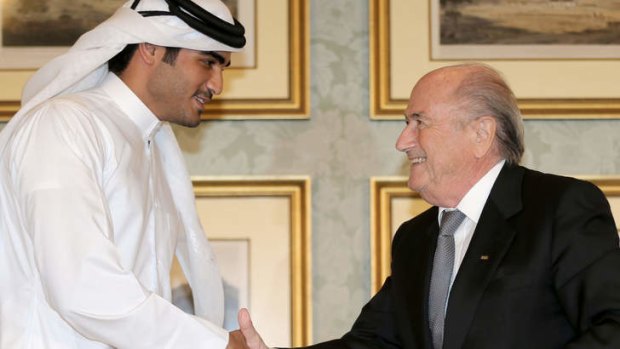 Chairman of the Qatar 2022 bid committee Sheikh Mohammed bin Hamad al-Thani shakes hands with FIFA president Sepp Blatter last week in Doha.
