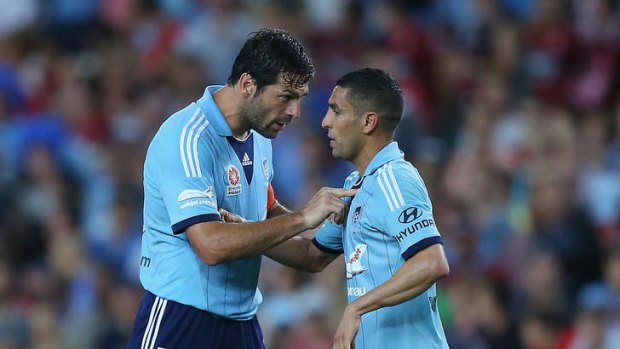 Sasa Ognenovski (L) of Sydney FC tries to calm down his team-mate Ali Abbas, who claims he was the victim of racist abuse.