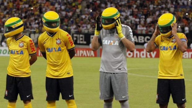 Players from the Corinthians soccer club wear replicas of the helmet worn by late Brazilian Formula One driver Ayrton Senna.