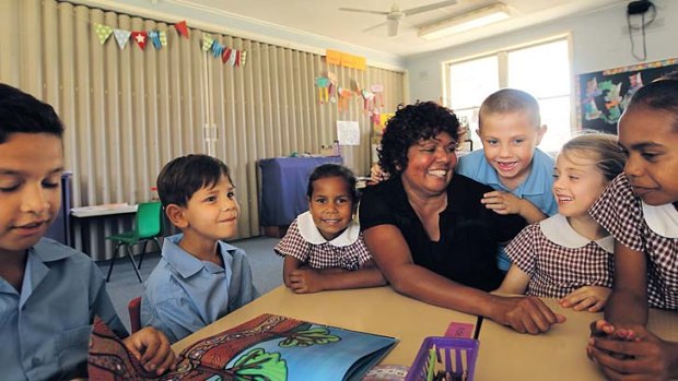 Listen up: Moree East Public School principal Muriel Kelly  with some of her charges.