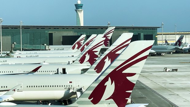Qatar Airways planes grounded at Doha Airport.
